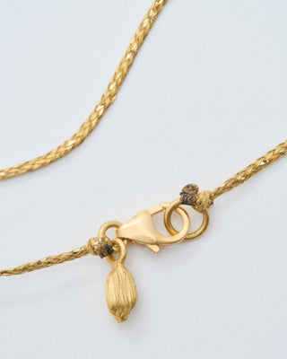 18kt gold the middle path drop and spinel on cord