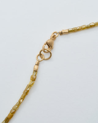 gold and yellow diamond cylinder beaded necklace