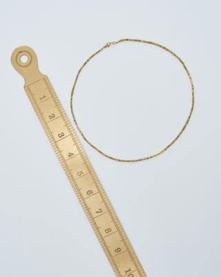 gold and yellow diamond cylinder beaded necklace