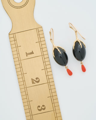 gold claw with onyx qual egg earrings
