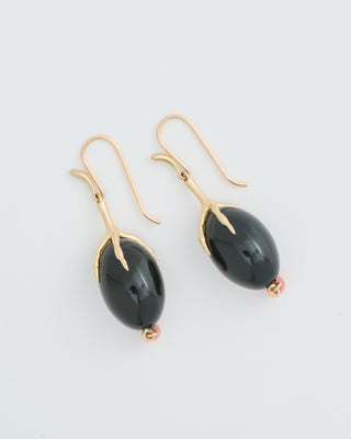 gold claw with onyx qual egg earrings