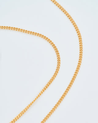 gold mini candy cane pendant on gourmette chain