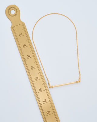 gold mini candy cane pendant on gourmette chain