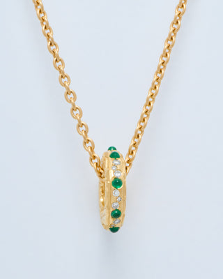 hag stone mini pendant w/ emeralds