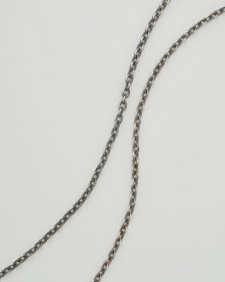 hung silver necklace with diamonds