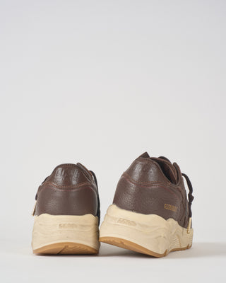 running sole leather upper toe star heel and spur sneaker