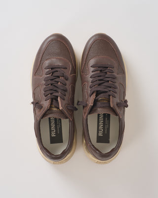 running sole leather upper toe star heel and spur sneaker