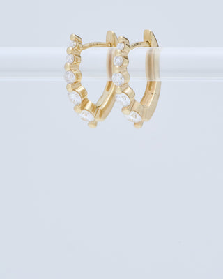 small oval graduated diamond huggie hoops - gold/diamonds