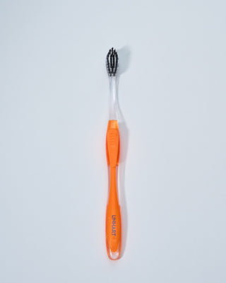 toothbrush w/ black bristles