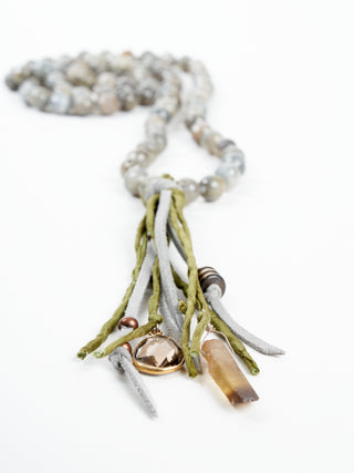 precious stone with leather and silk tassel
