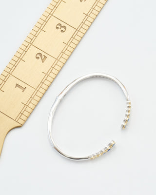 classic two-toned open bezel set sapphire bangle