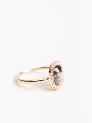 black oval diamond ring with halo setting