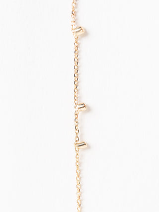 gold dust single strand earrings